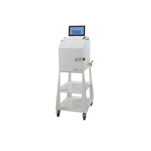 A white medical or laboratory device with a digital display screen on top, mounted on a cart with roller bases, two shelves, and a side nozzle.