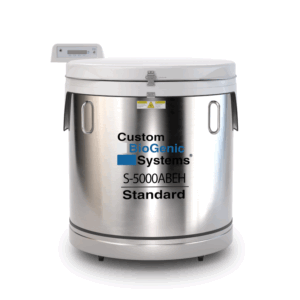 A large stainless steel S Series LN2 Freezer labeled “Custom BioGenic Systems s-5000ab-eh Standard,” featuring a digital display panel on top and warning stickers near the lid.